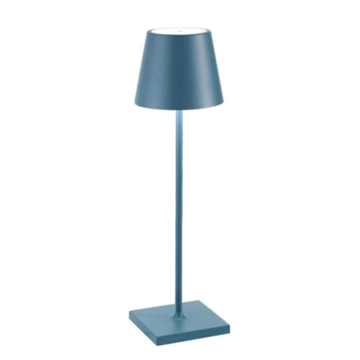 Minimalist modern LED table lamp, rechargeable and wireless, enhancing a clean office or living room.