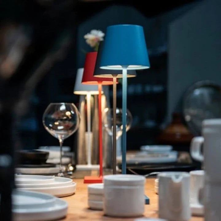 Versatile portable LED table lamp, rechargeable for use as a modern outdoor or indoor accent light.