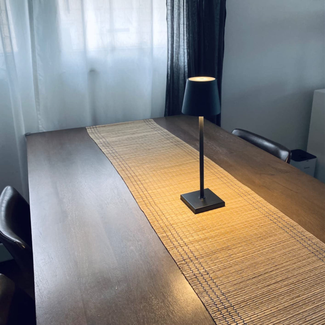 Modern wireless rechargeable LED table lamp in sleek design for contemporary indoor & outdoor lighting.