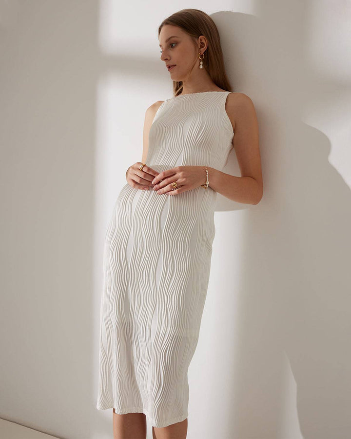 Stunning textured white midi dress for women, with elegant pearl straps. Perfect for evening parties & special events.