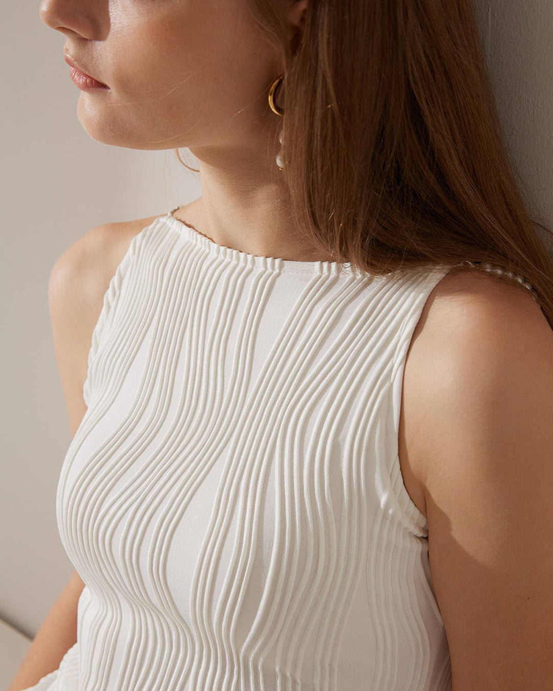 Chic sleeveless textured midi dress for women, elegant white with pearl straps. Perfect for evening & special occasions.