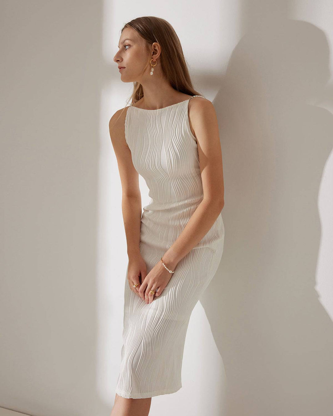 Elegant white textured cami midi dress for women, featuring chic pearl straps. Perfect for parties & special occasions.