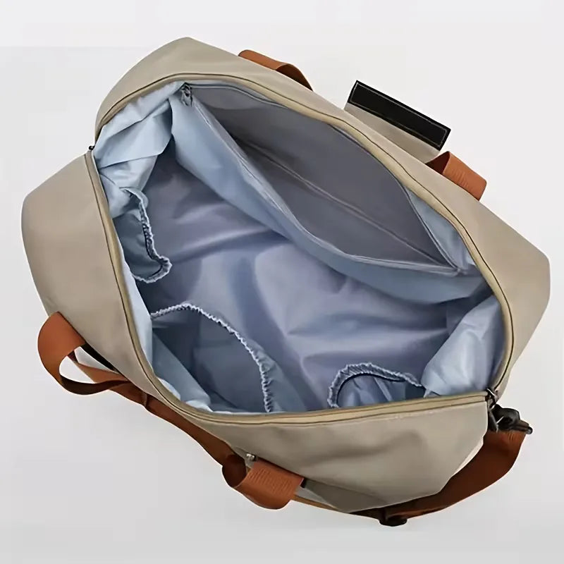 Durable black unisex travel duffle bag, ideal for sports or weekend getaways, features a shoe compartment.