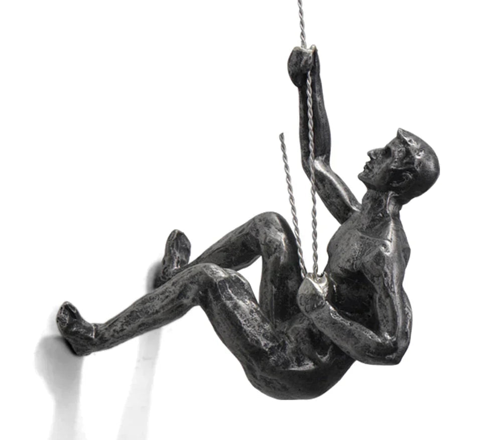 Modern art sculpture of a dynamic climber, ideal unique wall decor for contemporary interior design.