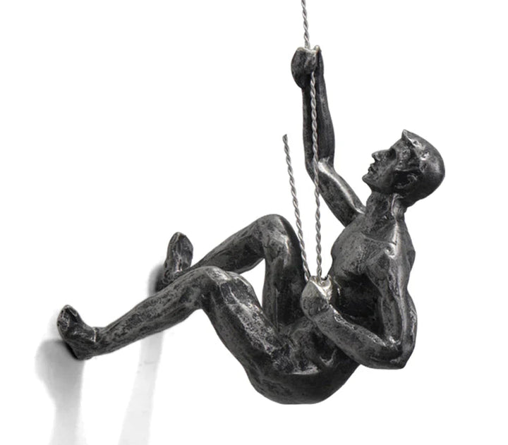 Modern art sculpture of a dynamic climber, ideal unique wall decor for contemporary interior design.