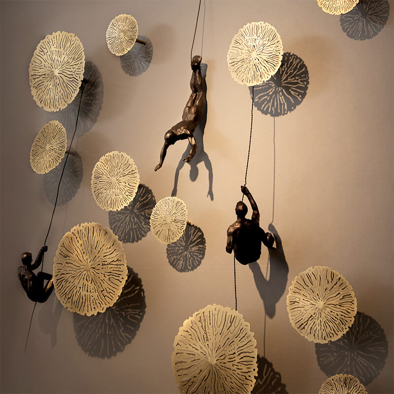 Unique dynamic climber wall art sculpture, contemporary decor for modern homes and office spaces.