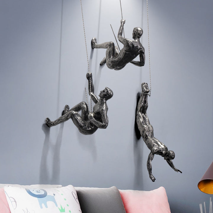 Striking dynamic climber wall sculpture, a modern art piece for contemporary home and office interior design.