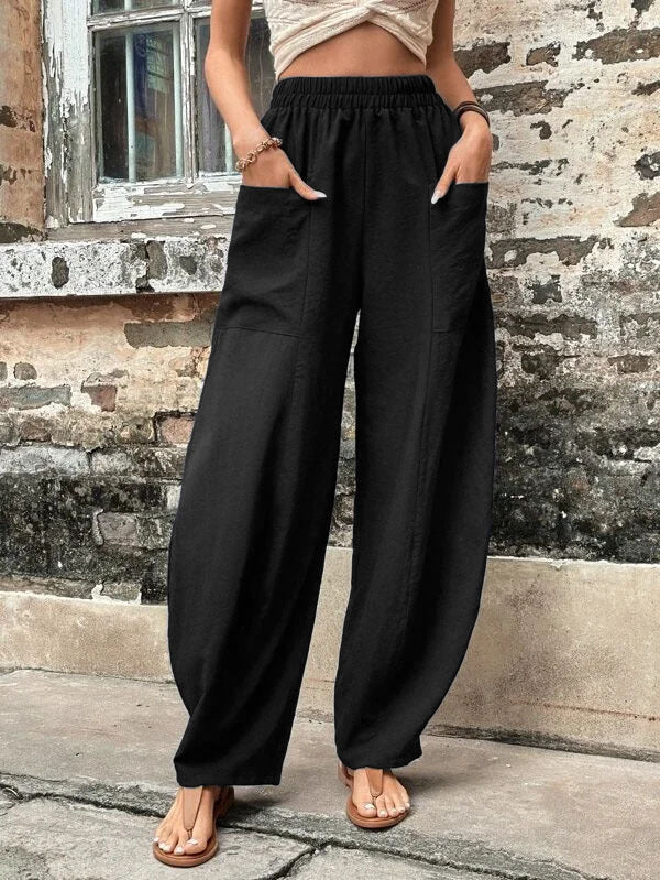 Versatile women's wide-leg palazzo trousers with pockets, styled for effortless everyday fashion and comfort.