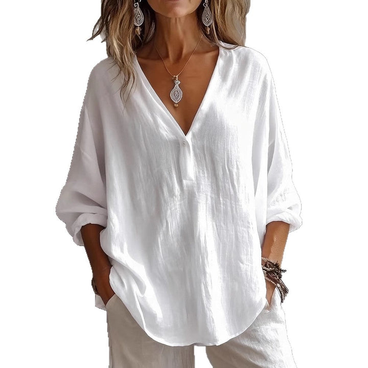 Loose solid color women's long-sleeve top, a comfort top for office attire or relaxed casual wear.