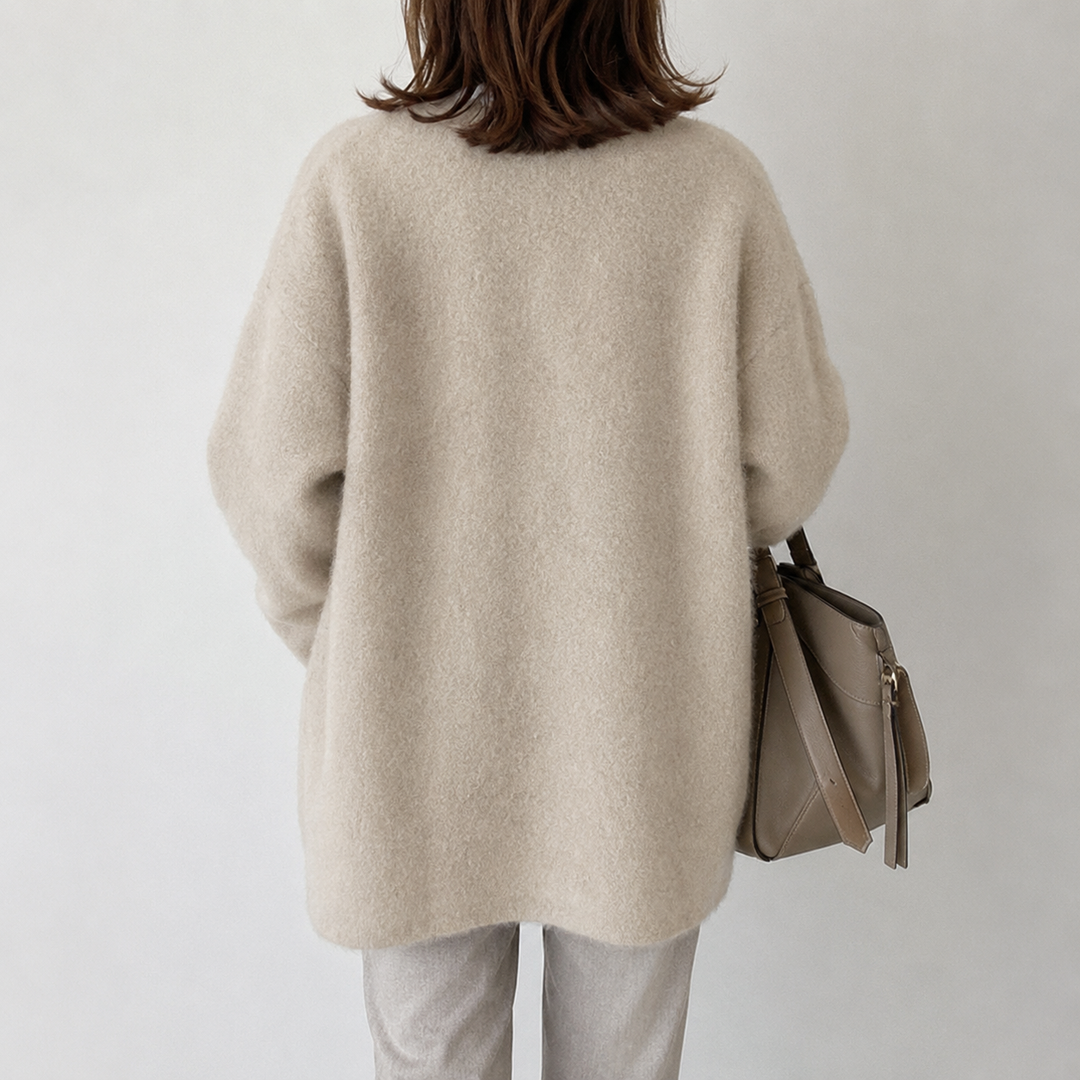 Chic women's button-front cardigan, mid-length for comfortable, versatile style.