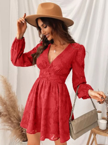Modern women's elegant dress, short length, with puff sleeves and a V-neck, suitable for parties and special occasions.