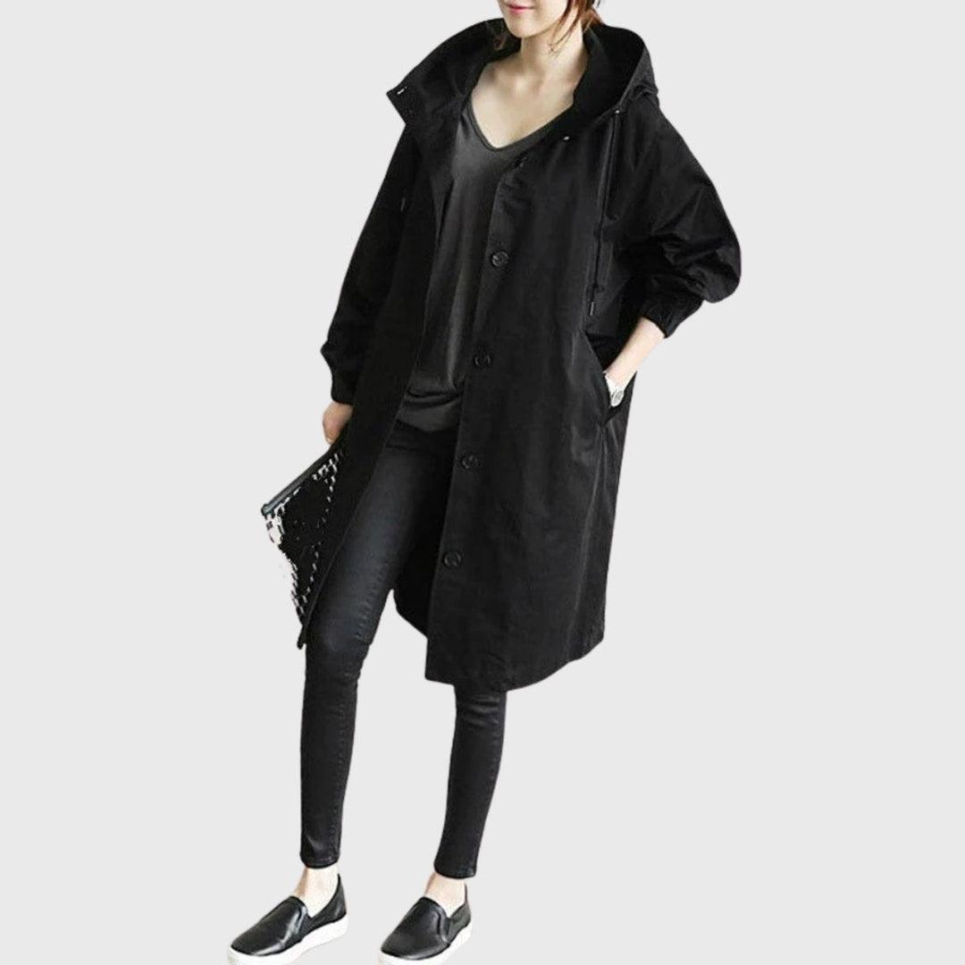 Elegant women's relaxed fit hooded trench coat, chic outerwear for versatile casual or travel style.