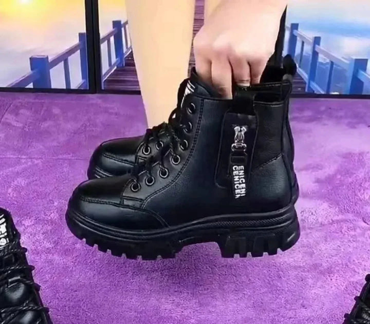 Trendy women's ankle-high leather combat boots, perfect for casual everyday wear, with side zip & lace-up detail.