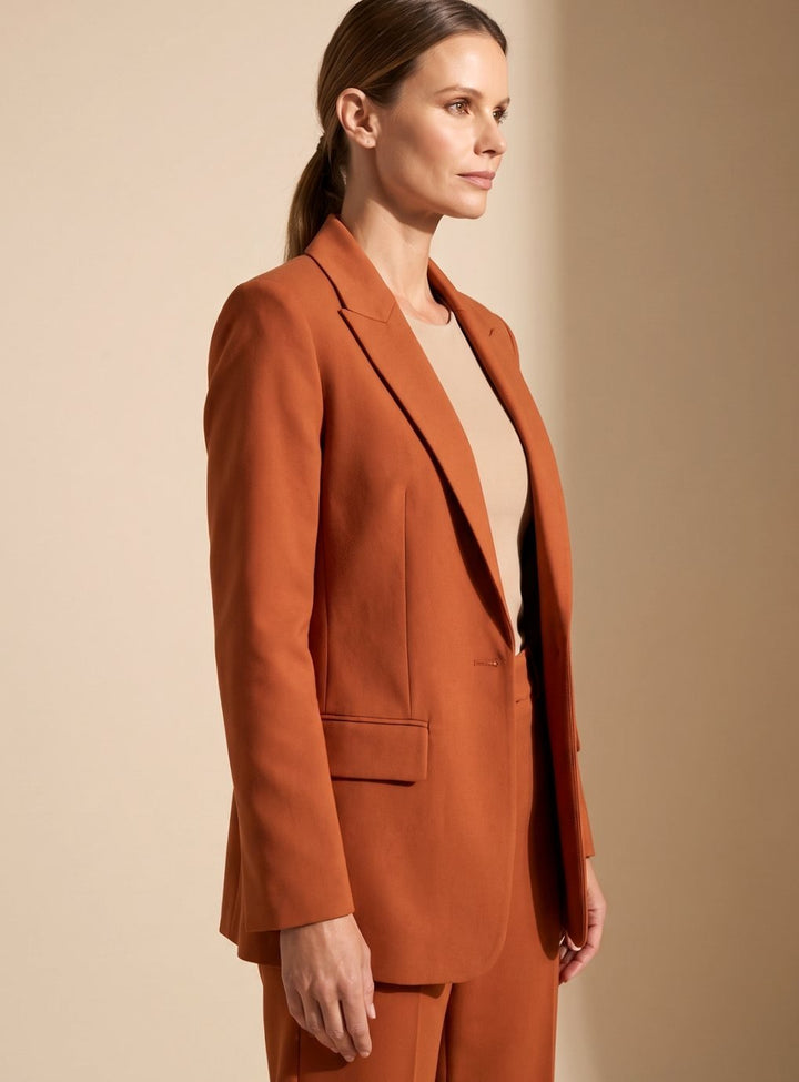 Women's professional two-piece set: elegant blazer & flattering flared trousers for a sophisticated office style.