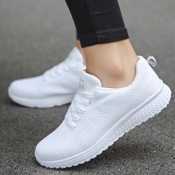 Light grey women's casual orthopedic lace-up sneakers, ideal for comfortable active everyday wear.
