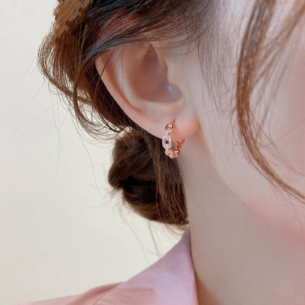 Elegant minimalist silver stud earrings, sparkling diamond inspired design for women.