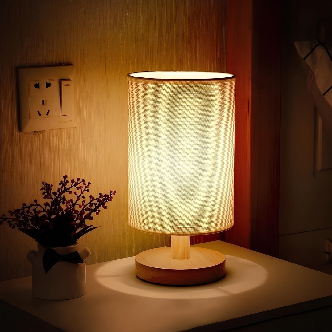Stylish Nvroome Organic Glow table lamp. Wood base, fabric shade, dimmable LED. Perfect for modern home lighting.