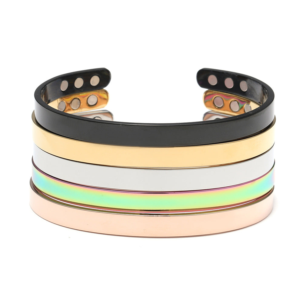 Polished wide glossy stainless steel magnetic cuff bracelet. Modern unisex jewelry piece.
