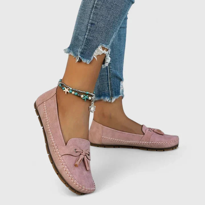 Women's elegant bow slip-on loafers. Comfortable flat shoes, versatile for everyday, office, or casual chic outfits.