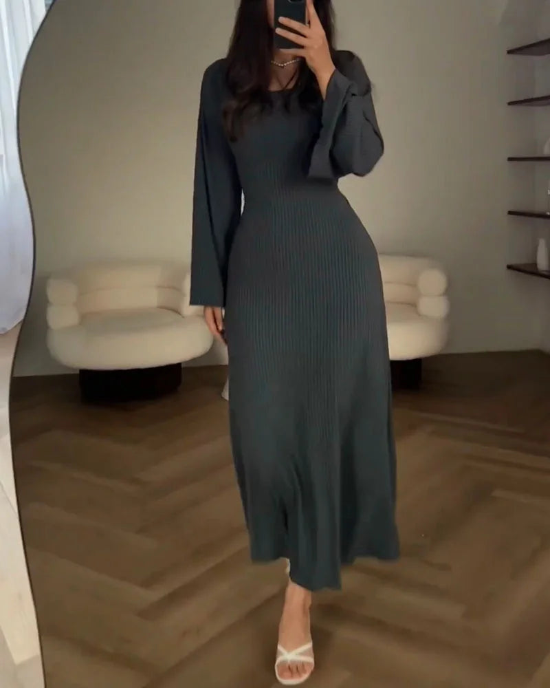Women's elegant long-sleeve party dress. A stylish maxi dress for evening events.