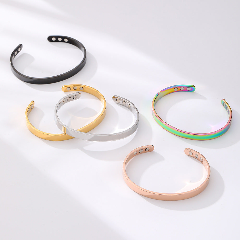 Unisex wide glossy stainless steel magnetic cuff bracelet. Modern elegant fashion accessory.