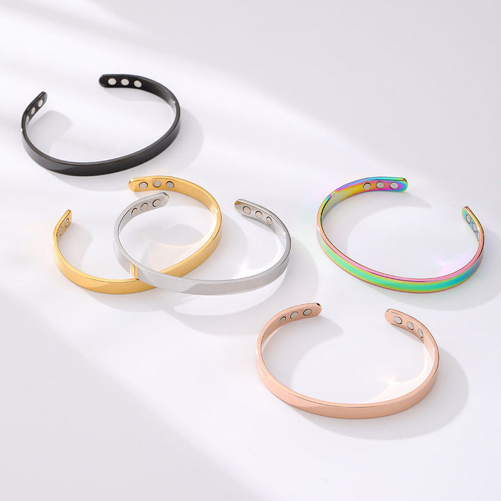 Unisex wide glossy stainless steel magnetic cuff bracelet. Modern elegant fashion accessory.