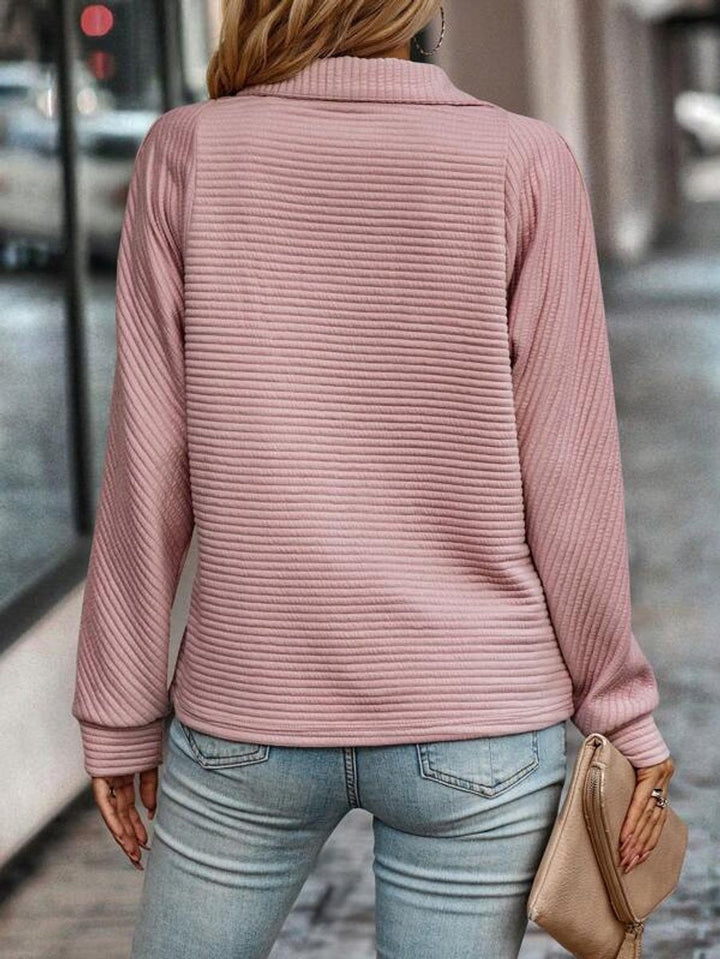 Women's long sleeve ribbed knit quarter-zip sweater with a relaxed fit for cozy everyday style.