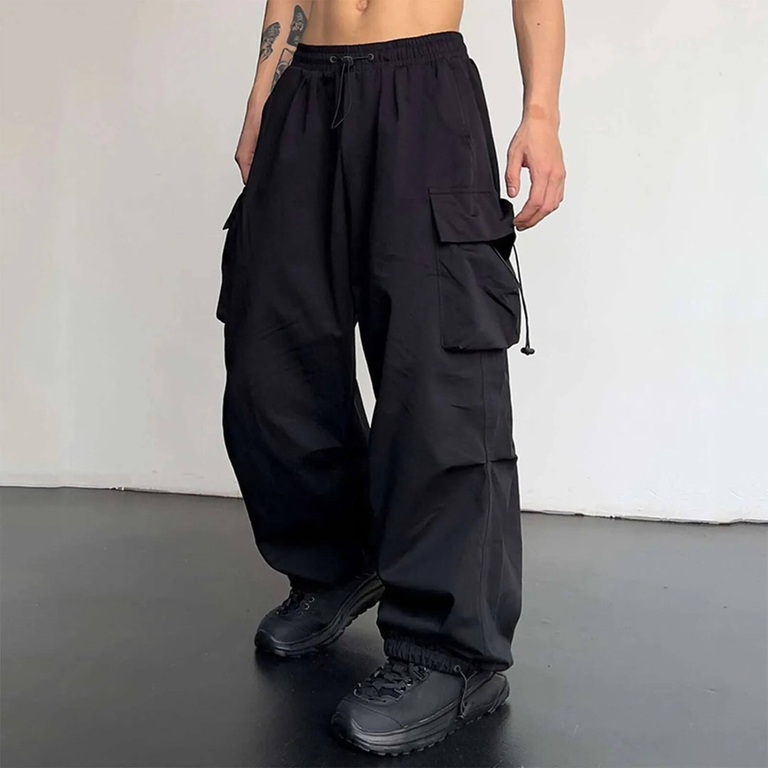 Side profile of multi-pocket cargo joggers, relaxed fit style perfect for streetwear outfits.
