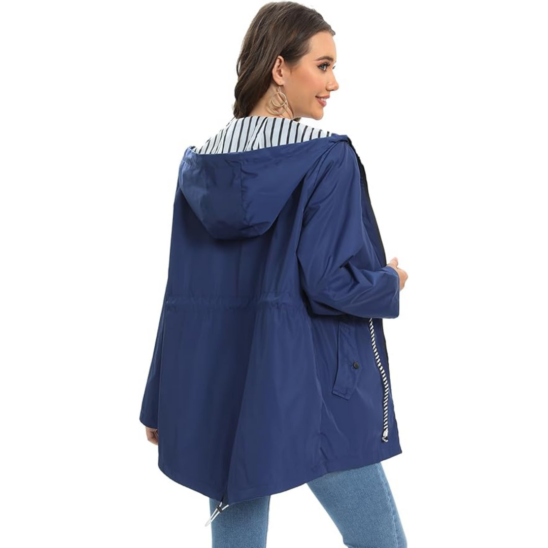 Protective women's lightweight rain jacket with an adjustable hood, ideal for unpredictable weather.