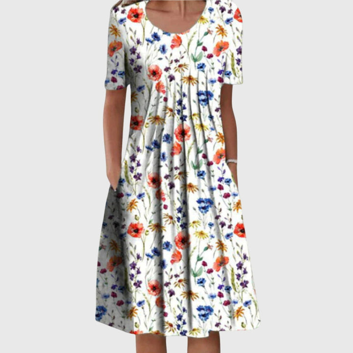 Elegant women's round neck midi dress with a beautiful floral print, perfect for summer or casual wear.
