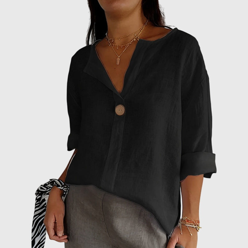 Sophisticated women's V-neck blouse with a single button, a stylish long-sleeve top suitable for office and casual wear.