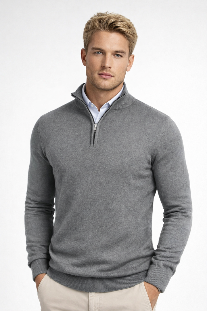 Close-up of a men's modern half zip high neck sweater, showcasing its soft texture & stylish design.