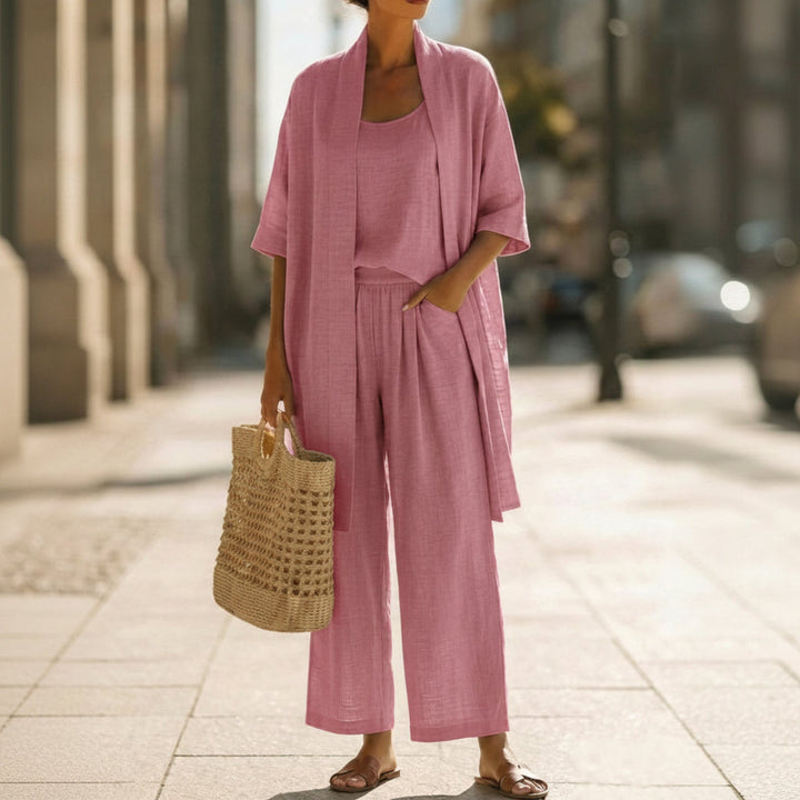 Comfortable women's three-piece knit co-ord set with a cozy cardigan, tank top, and straight-leg pants.