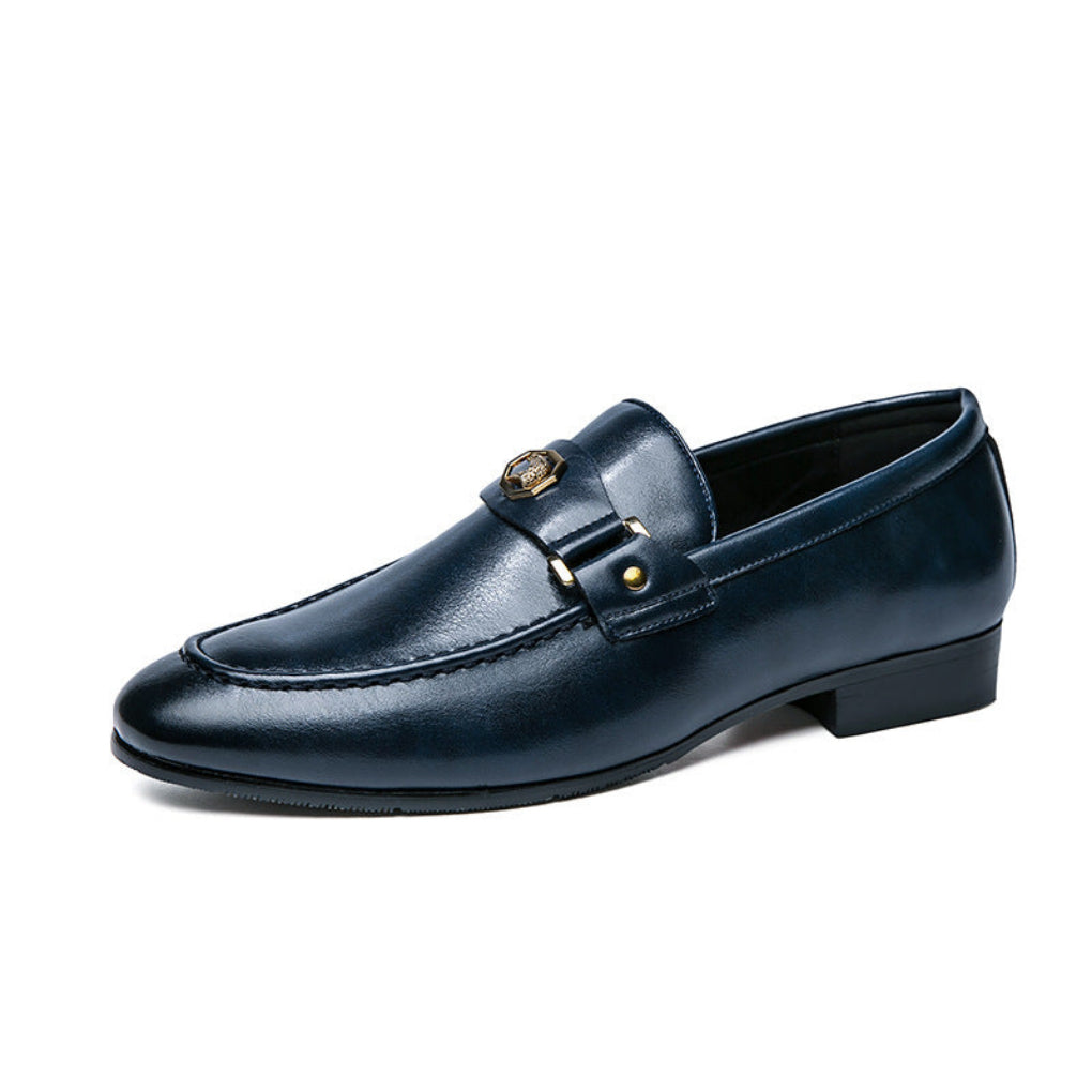 Stylish men's black slip-on loafers with a unique metal buckle design, offering comfort and a chic appearance.