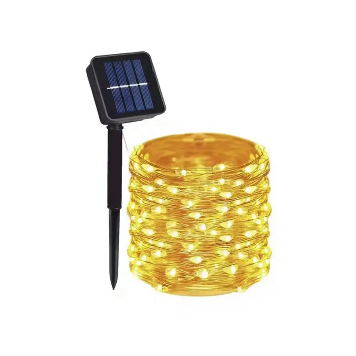 Warm white solar LED string lights illuminating a patio, creating an enchanting outdoor ambiance. Weatherproof garden decor.