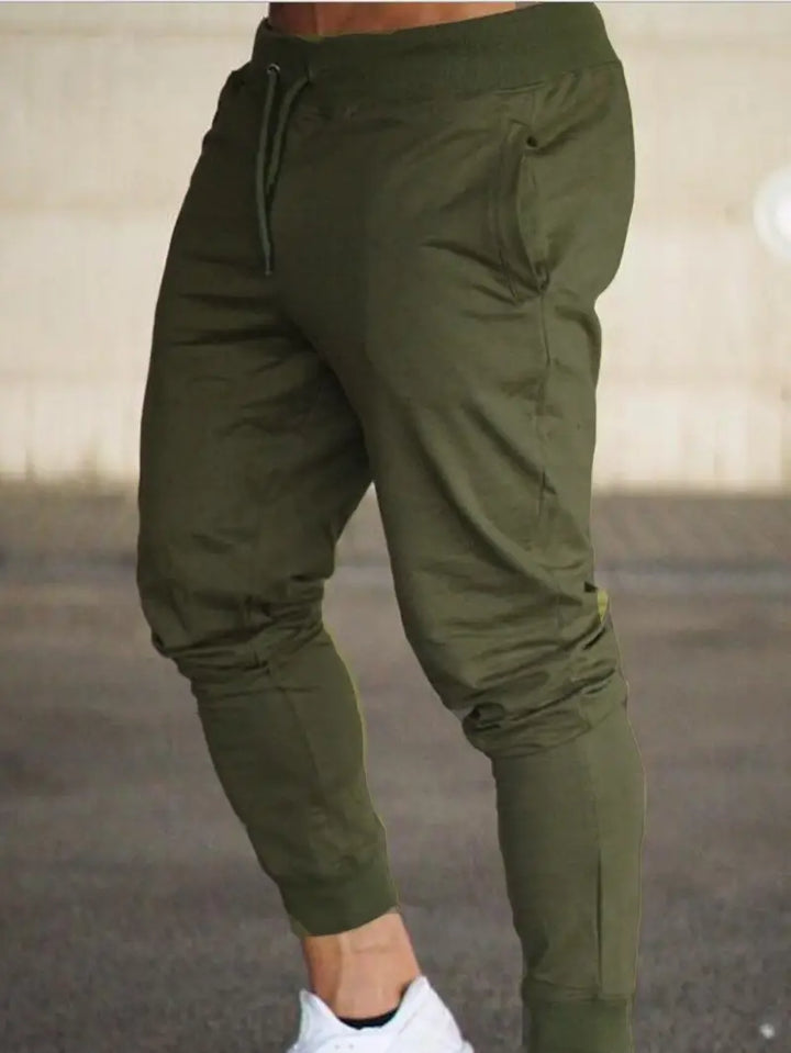 Red men's comfortable jogger pants, relaxed fit design, excellent for men's fashion, active or casual wear.