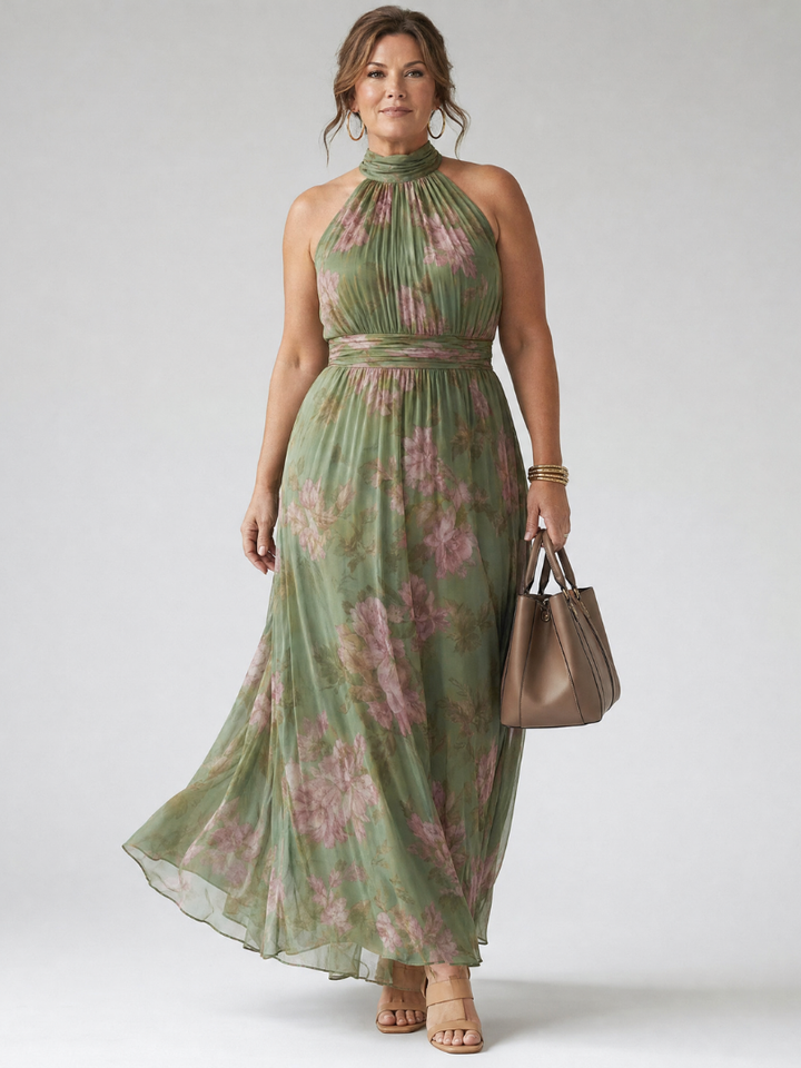 Back view of women's elegant sage green halter midi dress, showing flowy silhouette and gathered details.