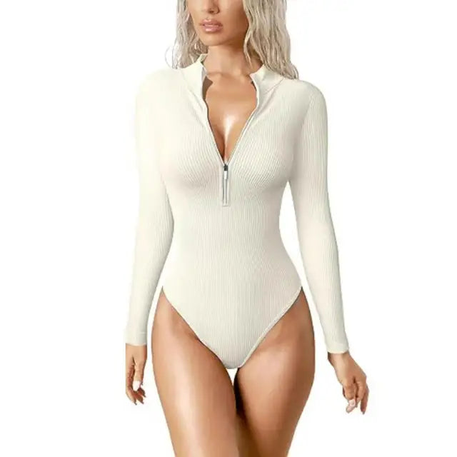Women's ribbed long sleeve zip-up one-piece swimsuit. Sleek beachwear for resort & poolside fashion.