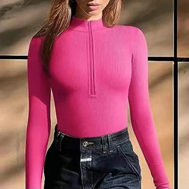 Modern women's ribbed long sleeve zip-up swimsuit. One-piece design, ideal for active beachwear & resort.