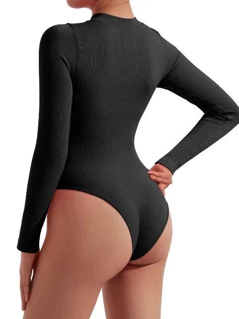 Durable women's ribbed long sleeve zip-up swimsuit. Active one-piece beachwear for water sports & resort.