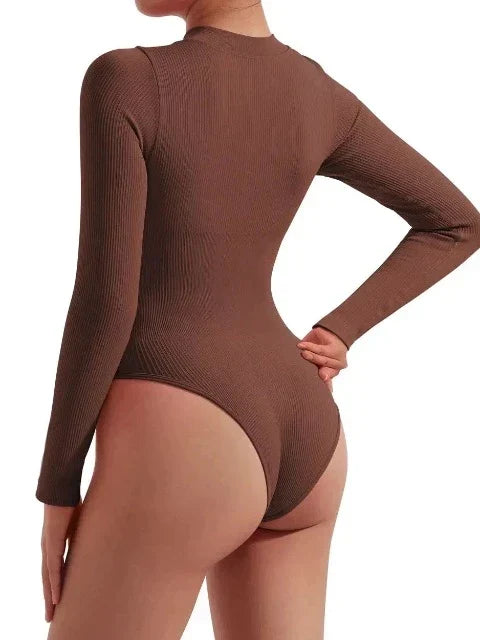 Fashion-forward women's ribbed long sleeve zip-up swimsuit. Elegant one-piece swimwear for resort wear.