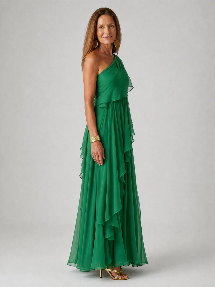 Close-up of the intricate asymmetric ruffle detailing on a women's sophisticated maxi dress.