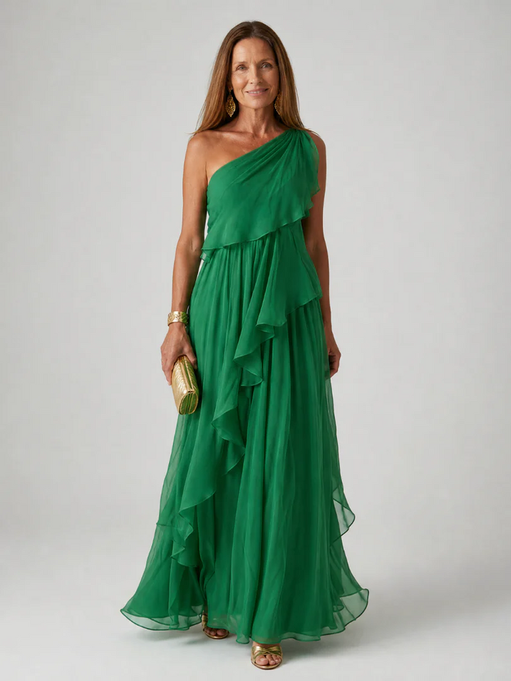 Beautiful flowy maxi dress for women, with elegant asymmetric ruffles, ideal for wedding guests.