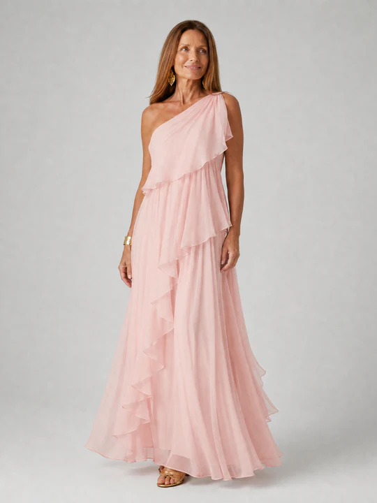 Full-length view of a sophisticated asymmetric ruffle maxi dress, perfect as a wedding guest outfit.