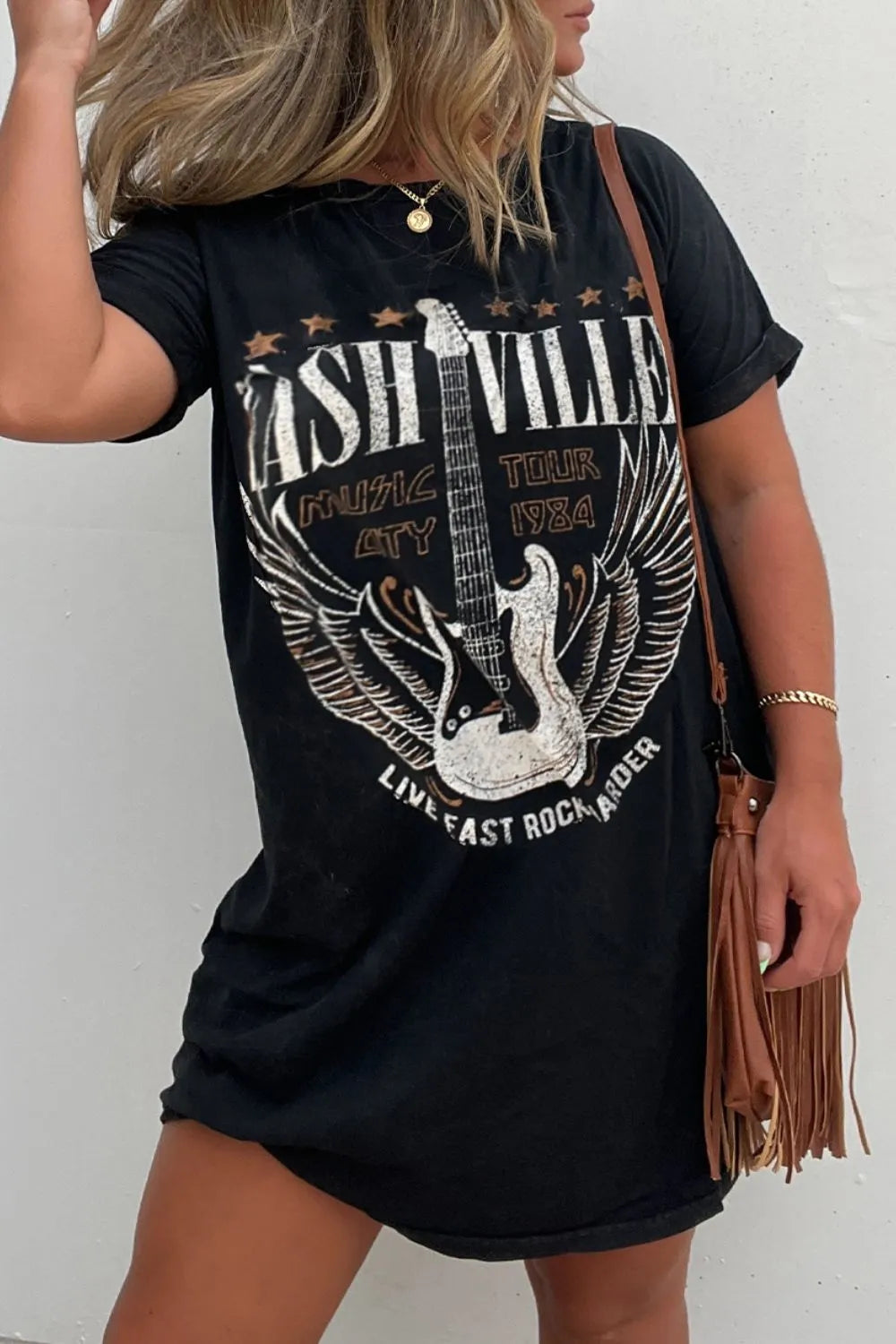 Stylish women's graphic tee dress, a black mini style perfect for casual outings.