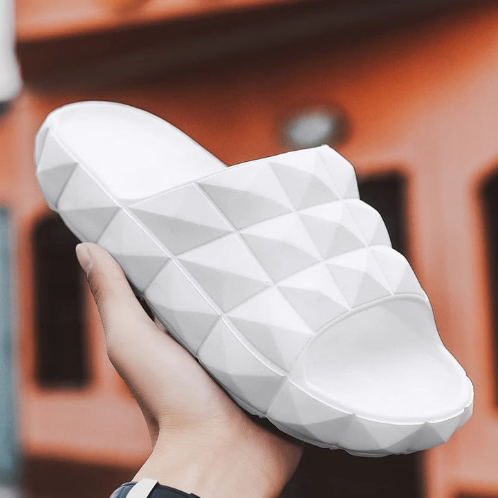 Durable men's comfort slides, featuring a geometric texture for pool and beach wear.