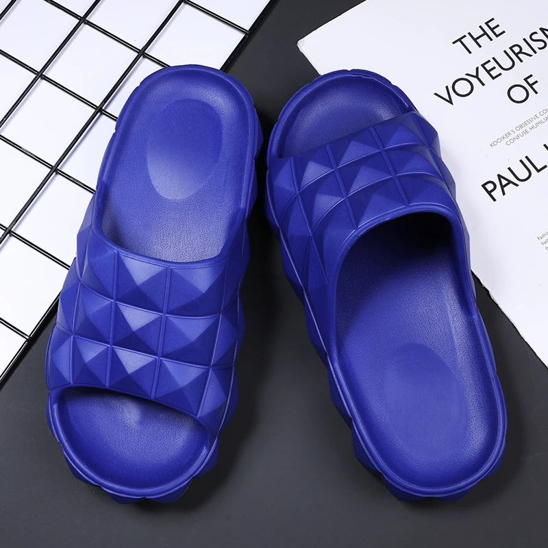 Comfortable men's slides featuring a unique geometric pattern and textured finish.