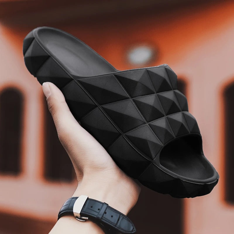 Textured men's slip-on slides, providing style and comfort for summer activities.