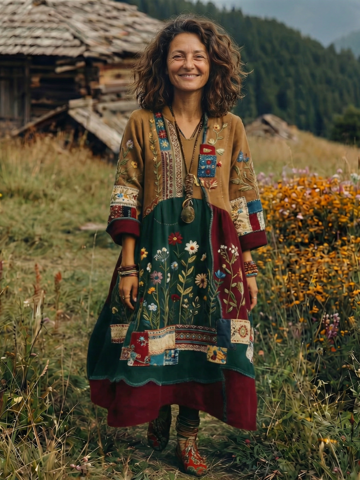 Woman wearing a comfortable flowy embroidered long sleeve midi dress, perfect for elegant casual wear.