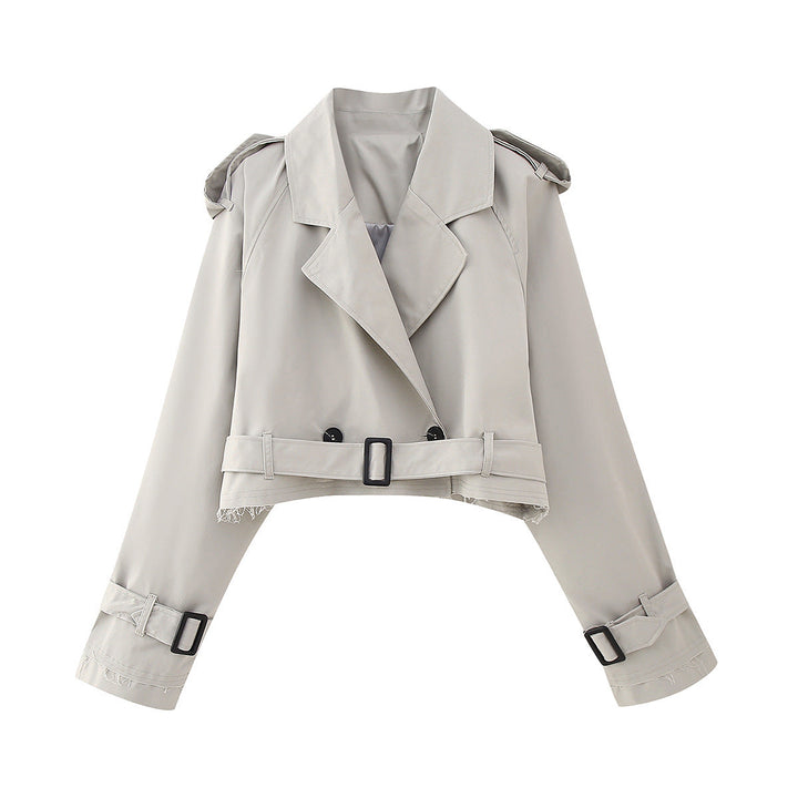 Cropped women's trench coat with a chic belt, ideal for transitional weather. Modern, elegant, and versatile outerwear.